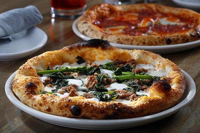 The Contento pizza, foreground, made with rapini (broccoli raab) bean ...