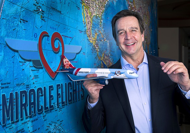 Mark E. Brown, CEO of Miracle Flights, poses in the charity's offices Monday, Nov. 27, 2017. Miracle Flights provides air travel to low-income children who need to obtain special medical care.