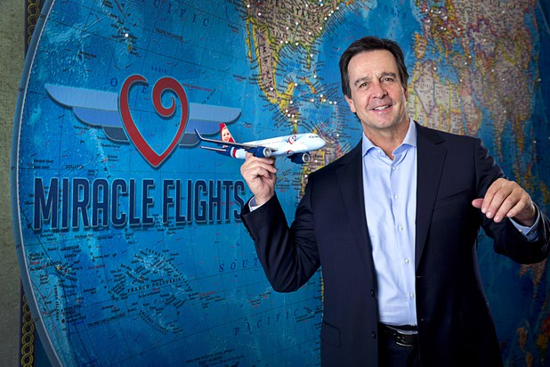 Mark E. Brown, CEO of Miracle Flights, poses in the charity's offices Monday, Nov. 27, 2017. Miracle Flights provides air travel to low-income children who need to obtain special medical care.