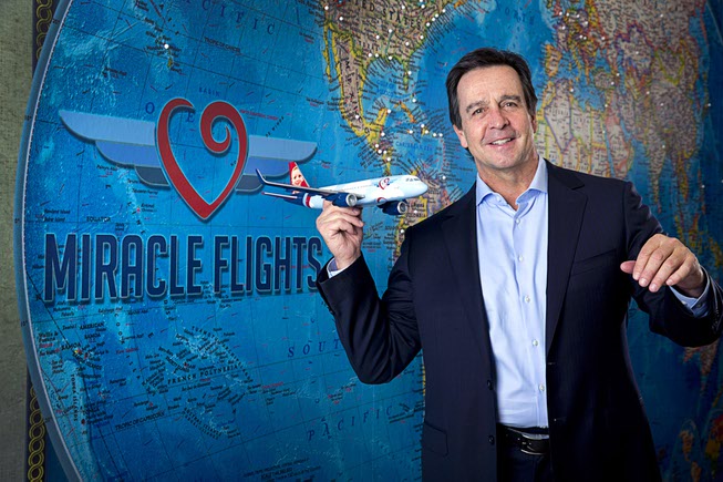 Mark E. Brown, CEO of Miracle Flights, poses in the ...