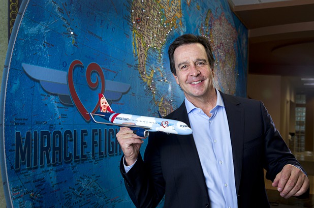 Mark E. Brown, CEO of Miracle Flights, poses in the charity's offices Monday, Nov. 27, 2017. Miracle Flights provides air travel to low-income children who need to obtain special medical care.