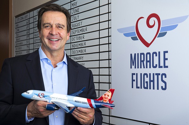 Mark E. Brown, CEO of Miracle Flights, poses in the charity's offices Monday, Nov. 27, 2017. Miracle Flights provides air travel to low-income children who need to obtain special medical care.