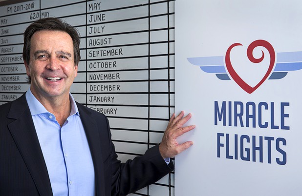 Mark E. Brown, CEO of Miracle Flights, poses in the charity's offices Monday, Nov. 27, 2017. Miracle Flights provides air travel to low-income children who need to obtain special medical care.