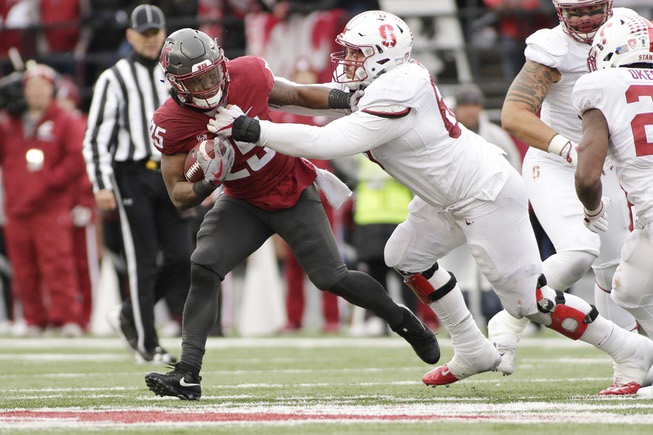 Stanford defensive tackle Harrison Phillips, right, tackles Washington State running ...