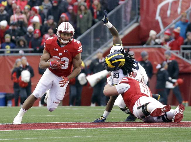 Wisconsin's Jonathan Taylor runs during an NCAA college football game against Michigan Saturday, Nov. 18, 2017, in Madison, Wis. 
