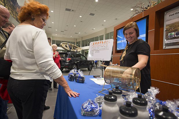 Abbey Dalla pulls winning raffle tickets from a drum during a dealership debut for Subaru owners and employees at the new Subaru Las Vegas facility, a two-story building with 65,500 sq. ft. on Roy Horn Way between Rainbow and Jones boulevards, Wednesday, Nov. 29, 2017.
