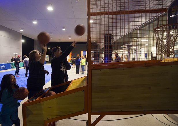 Children and teens play a basketball game during a dealership debut for Subaru owners and employees at the new Subaru Las Vegas facility, a two-story building with 65,500 sq. ft. on Roy Horn Way between Rainbow and Jones boulevards, Wednesday, Nov. 29, 2017.
