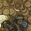 This April 3, 2013, file photo shows bitcoin tokens at software engineer Mike Caldwell's shop in Sandy, Utah.