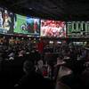 Bettors on Oct. 1, 2017, at the Westgate SuperBook in Las Vegas, where wagering on college football games is rising at the expense of betting on NFL games. 