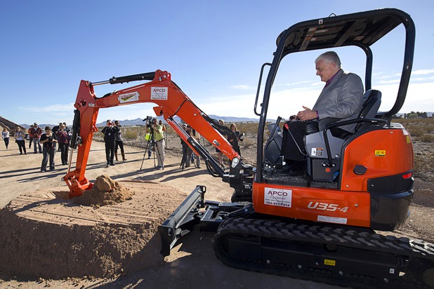 Clark County Commission Chairman Steve Sisolak uses a mini-excavator to break ground during a ceremony for a $34 million Interstate-15 and Starr Avenue interchange project Thursday, Nov. 30, 2017. The interchange, part of a $1.3 billion I-15 South Corridor project, is expected to be completed in May 2019.