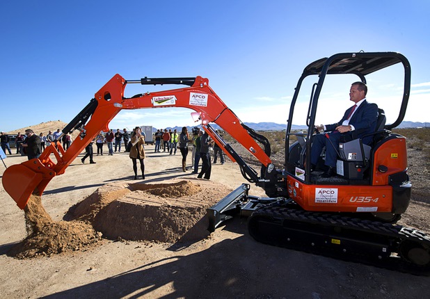 Nevada Lt, Governor Mark Hutchison uses a mini-excavator to break ground during a ceremony for a $34 million Interstate-15 and Starr Avenue interchange project Thursday, Nov. 30, 2017. The interchange, part of a $1.3 billion I-15 South Corridor project, is expected to be completed in May 2019.