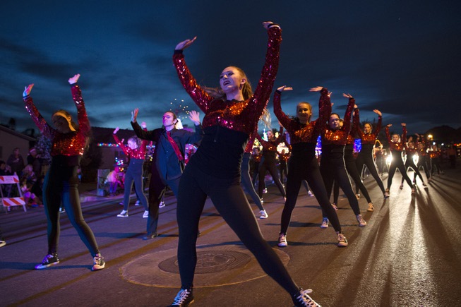 A dance team performs during the Santa's Electric Parade Saturday, ...