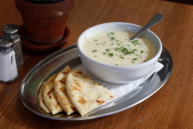Avgolemono, a traditional chicken soup with rice and lemon, at Meraki Greek Grill, 4950 S. Rainbow Blvd., Wednesday Dec. 6, 2017. Served with pita bread.
