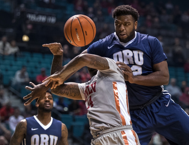 UNLV's forward Tervell Beck (14) takes a hard foul over ...