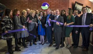 A ribbon is cut as Safe Nest unveils a new office and treatment center to better serve those in Las Vegas and commemorate their 40th anniversary continuing their commitment to those affected by domestic violence issues in Nevada on Thursday, Dec. 7, 2017.
