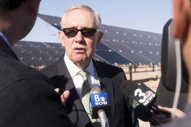 Former Sen. Harry Reid talks to reporters following a ceremony to celebrate the commissioning of the 179-megawatt Switch Stations 1 and 2 Solar Projects, Monday, Dec. 11, 2017.  This is the first project to be built on one of the Bureau of Land Management's Solar Energy Zones.