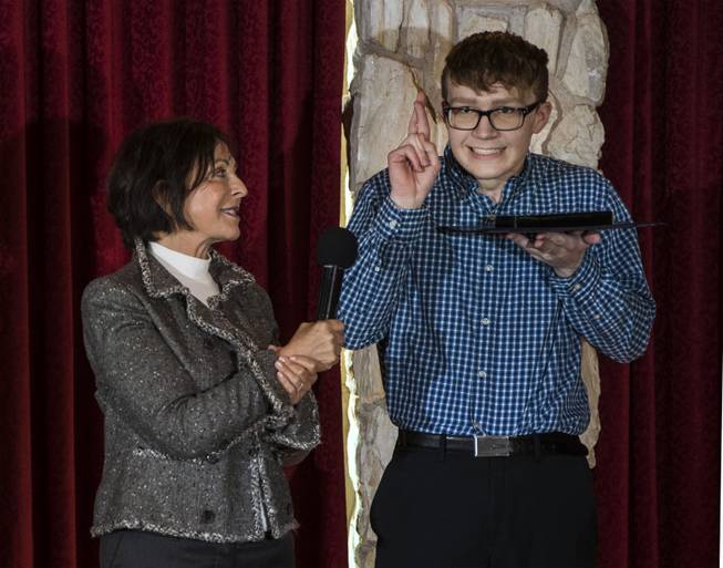 Myra Greenspun looks to Ian Green of the Advanced Technologies Academy as he gestures during the Las Vegas Sun Youth Forum luncheon on Tuesday, Dec. 12, 2017. The Event honors the 28 student representatives selected at the 2017 Las Vegas Sun Youth Forum at the Las Vegas Country Club.