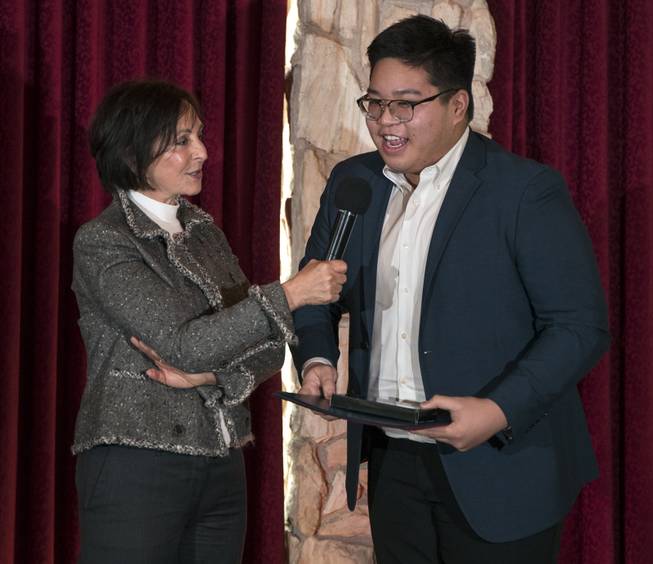 Myra Greenspun looks to Dawson Mullen of the Northwest Career and Technical Academy as he answers a question during the Las Vegas Sun Youth Forum luncheon on Tuesday, Dec. 12, 2017. The Event honors the 28 student representatives selected at the 2017 Las Vegas Sun Youth Forum at the Las Vegas Country Club.