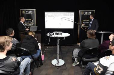 Golden Knights vice president Murray Craven, right, and director of hockey operations Misha Donskov break down film during the franchise’s VGK University fan initiative class.