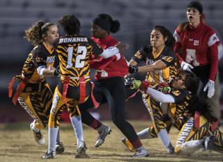 Arbor View's Jasmine Gordon (2) battles through the Bonanza defense on a run during their varsity girls flag football game on Tuesday, Dec. 12, 2017.