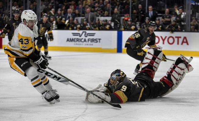Vegas Golden Knights goalie Marc-Andre Fleury (29) leaves the goal to stop a shot on the ice by Pittsburgh Penguins left wing Conor Sheary (43) during their game at the T-Mobile Arena. 