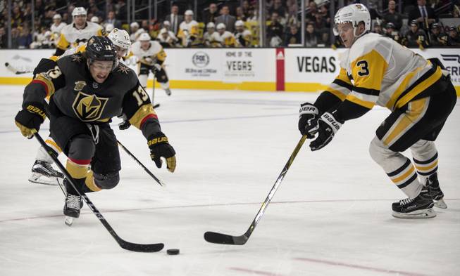 Vegas Golden Knights left wing Brendan Leipsic (13) drives towards the net as Pittsburgh Penguins defenseman Olli Maatta (3) intercepts during their game at the T-Mobile Arena on Thursday, Dec. 14, 2017.