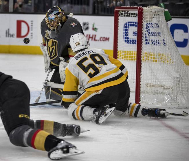 Vegas Golden Knights goalie Marc-Andre Fleury (29) rejects a shot with Pittsburgh Penguins center Jake Guentzel (59) in close during their game at the T-Mobile Arena on Thursday, Dec. 14, 2017.