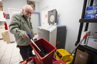 Rick Reich, program director of Trac-B Exchange, a Southern Nevada Health District funded needle-exchange program, loads full sharps containers into Sterilis, a new machine that discards used needles at the Harm Reduction Center in Las Vegas on Monday, Dec. 11, 2017.