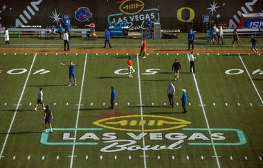 The Oregon Ducks and Boise State Broncos warm up to face each other during the Las Vegas Bowl at Sam Boyd Stadium.