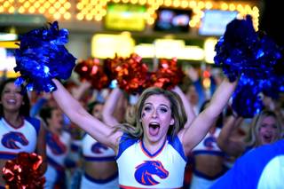 Boise State cheerleader Chelsea Borlase participates during a pep rally at the Fremont Street Experience Friday, Dec. 15, 2017, in Las Vegas. The Boise State Bronco will take on the Oregon Ducks in the 26th edition of the Las Vegas Bowl at Sam Boyd Stadium on Saturday.