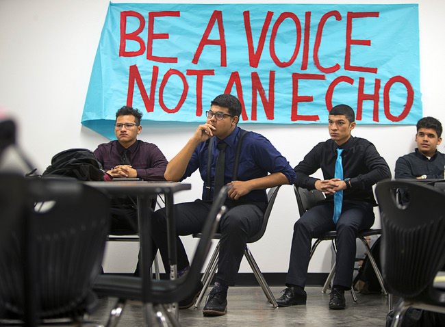Students listen to a presentation during an AP U.S. Government at the Equipo Academy charter school Thursday, Dec. 21, 2017. The school will graduate its first class this June and is aiming to have 100% of seniors accepted to college.