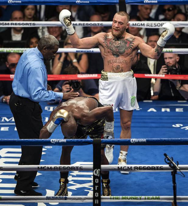 Super welterweight Conor McGregor is dismayed at another punch to the back of the head of Floyd Mayweather Jr. during their fight at the T-Mobile Arena on Saturday, August 26, 2017.