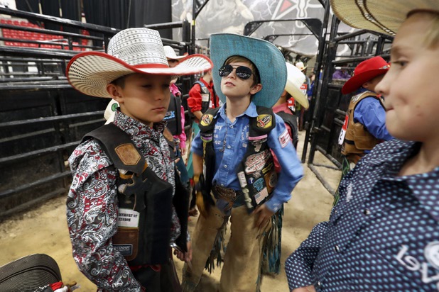Riders wait for opening ceremonies during the first round of the Chris Shivers Miniature Bull Riders (MBR) World Finals at the South Point Arena Wednesday, Nov. 1, 2017. The top 10 pee wees (9-10), juniors (10-11), and seniors (12-14) are competing for the world championship in their respective divisions.