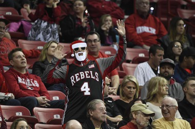 A UNLV fan wearing a Christmas mask dances during their NCAA basketball game against the Northern Colorado Bears Friday, December 22, 2017, at the Thomas & Mack Center. UNLV won the game 94-91 to move their record to 11-2.