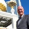 In this Oct. 17, 2017 photo, Republican Mayor Don Guardian speaks on the Boardwalk in Atlantic City, N.J. in front of the former Trump Taj Mahal casino, which will reopen in 2018 as a Hard Rock casino resort. Guardian, who lost his re-election bid last month, says he has no regrets about his tumultuous four-year term, which saw the closure of 5 of the city's 12 casinos, and a state takeover. He will become the administrator for Toms River next month. 