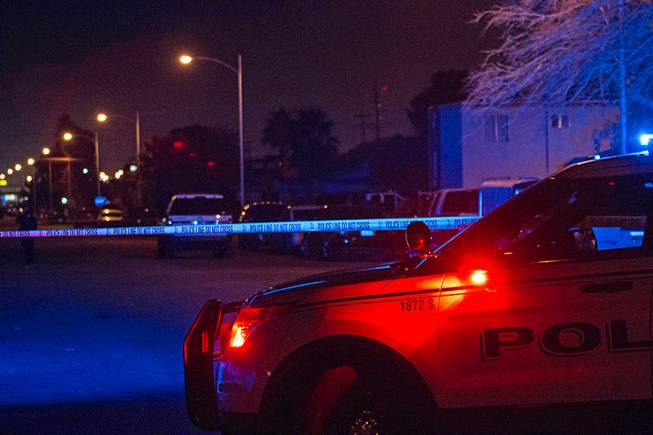 North Las Vegas police investigate early Friday, Dec. 29, 2017, after three people were found shot dead hours earlier inside an apartment in the 2200 block of Carroll Street. 