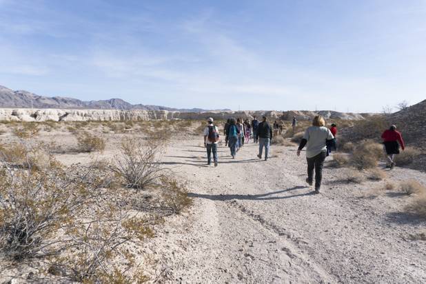 Visitors follow Park Ranger Garrett Fehner as they enter Ice Age Fossils State ParkLas Vegas' newest state park where visitors can explore and learn about fossil beds located in the areaduring a ranger-guided hike Monday, Jan. 1, 2018. With the park still in development, a visitor's center, interpretive trails and more infographic signs are expected to complete the park within two years.
