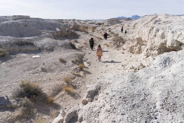 Visitors walk through Ice Age Fossils State ParkLas Vegas' newest state park where visitors can explore and learn about fossil beds located in the areaduring a ranger-guided hike, Monday, Jan. 1, 2018. With the park still in development, a visitor's center, interpretive trails and more infographic signs are expected to complete the park within two years.