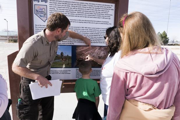 Park Ranger Garrett Fehner points out the areas visitors explored at Ice Age Fossils State ParkLas Vegas' newest state park where visitors can explore and learn about fossil beds located in the areaduring a ranger-guided hike, Monday, Jan. 1, 2018. With the park still in development, a visitor's center, interpretive trails and more infographic signs are expected to complete the park within two years.