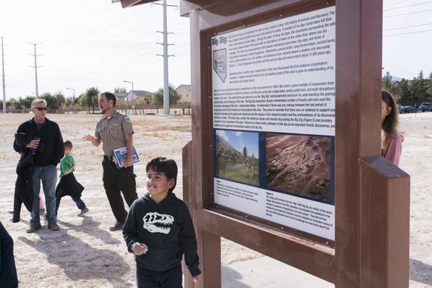 Park Ranger Garrett Fehner answers questions from visitors at Ice Age Fossils State ParkLas Vegas' newest state park where visitors can explore and learn about fossil beds located in the areafollowing a ranger-guided hike, Monday, Jan. 1, 2018. With the park still in development, a visitor's center, interpretive trails and more infographic signs are expected to complete the park within two years.