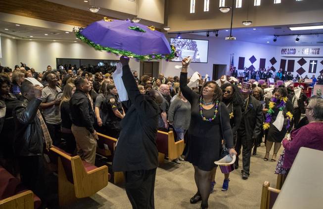 Family members and friends lead a New Orleans style recessional following a remembrance service for LaTosha Juane White at the Unity Baptist Church, she one of two security officers recently killed by a gunman at Arizona Charlie's on Saturday, Jan. 6, 2018.