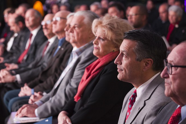 Gov. Brian Sandoval, second from right, looks on as Gary ...
