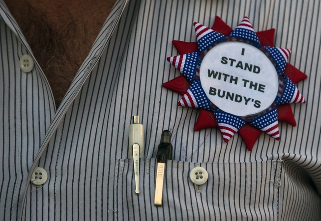 A Cliven Bundy supporter wears a badge of support during ...
