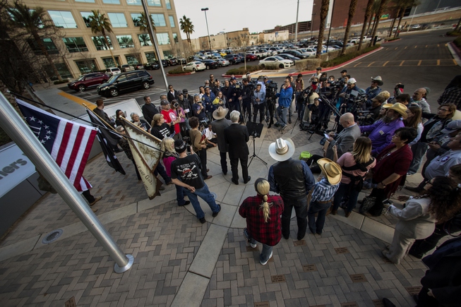 Supporters gather about as Cliven Bundy speaks during his press ...