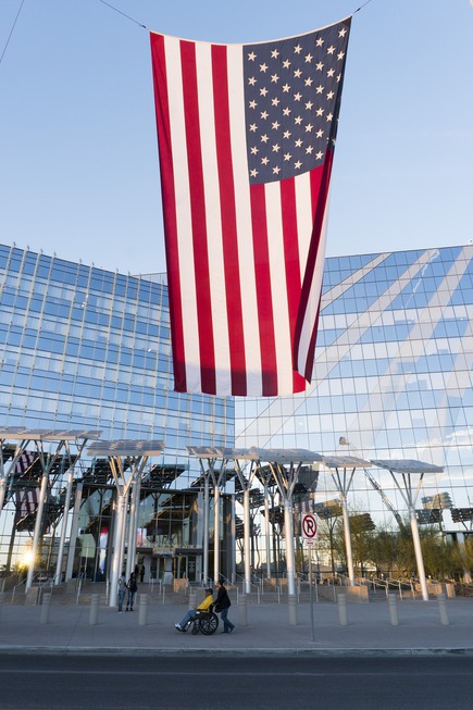 A giant flag hangs outside City Hall for Las Vegas ...