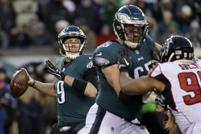 Philadelphia Eagles' Nick Foles looks for a reciever during the NFL divisional playoff against the Atlanta Falcons, Saturday, Jan. 13, 2018, in Philadelphia. The Eagles defeated the Falcons, 15-10, to advance to the NFC Championship Game next week in Philadelphia.


