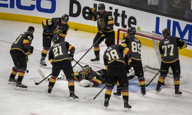 Vegas Golden Knights goaltender Marc-Andre Fleury (29) dives on the ice to protect the net from teammates during warm ups before their game at the T-Mobile Arena on Saturday, Jan. 13, 2018.  L.E. Baskow