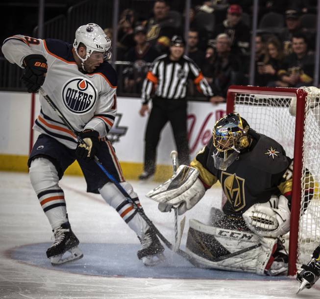 Edmonton Oilers left wing Patrick Maroon (19) scores in close on Vegas Golden Knights goaltender Marc-Andre Fleury (29) during their game at the T-Mobile Arena on Saturday, Jan. 13, 2018.  L.E. Baskow