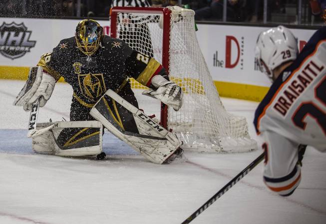 Vegas Golden Knights goaltender Marc-Andre Fleury (29) stops a shot with his pad from Edmonton Oilers center Leon Draisaitl (29) during their game at the T-Mobile Arena on Saturday, Jan. 13, 2018.  L.E. Baskow