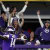 In this Sunday, Jan. 14, 2018, photo, Minnesota Vikings wide receiver Stefon Diggs (14) celebrates in the end zone after a making the game-winning touchdown against the New Orleans Saints late the second half of an NFL divisional football playoff game in Minneapolis,. The Vikings defeated the Saints 29-24.